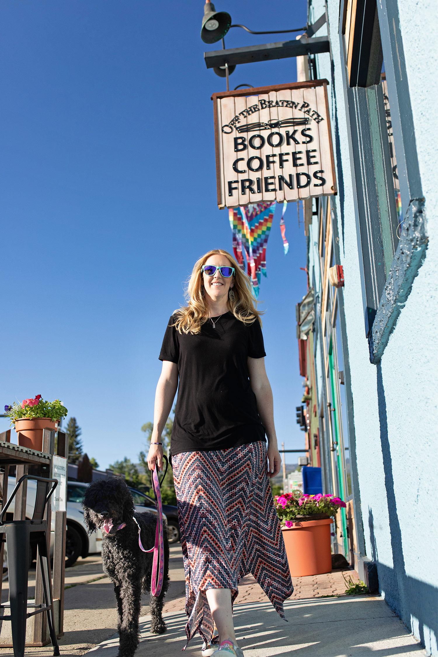 Tracy Tydeman with Dog in Front of Bookstore